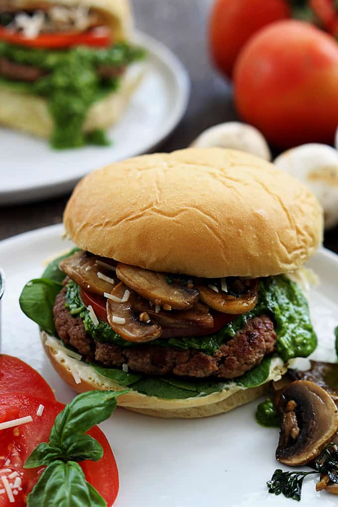 close p of a garlic pesto turkey burger on a plate.