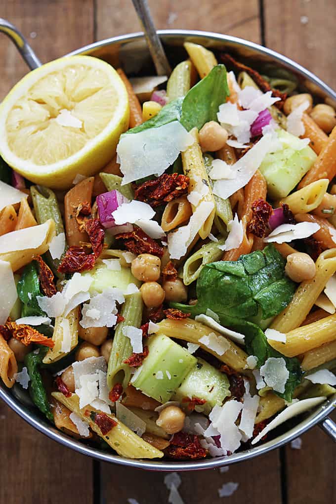 top view of Greek pasta salad in a metal bowl.