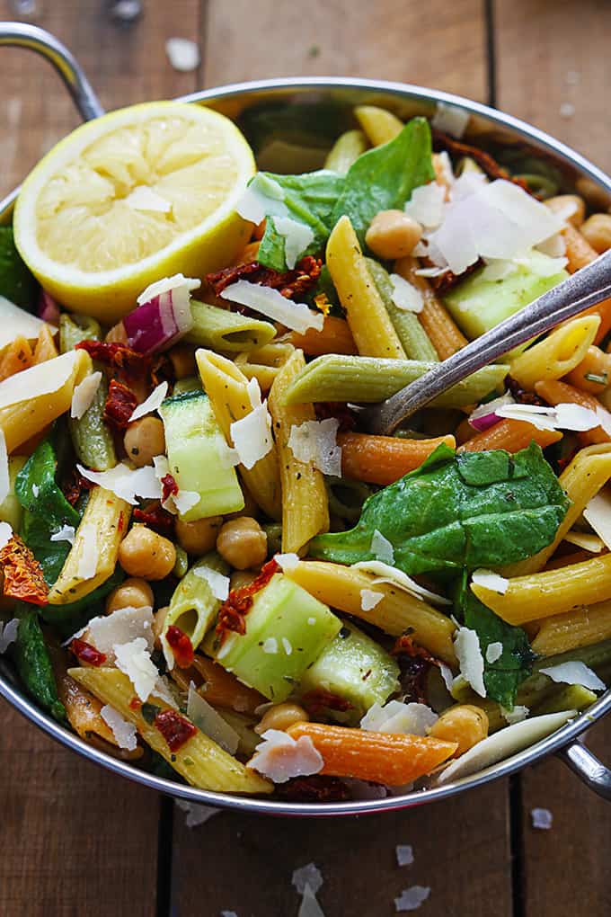 Greek pasta salad in a metal bowl.