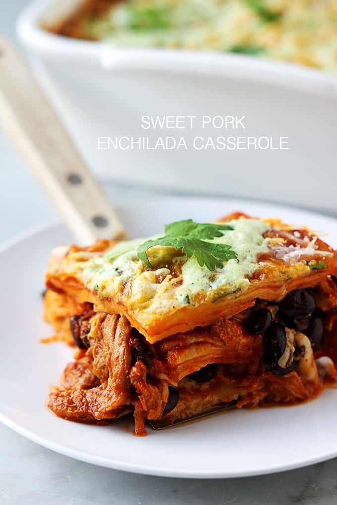 enchilada casserole on a plate with the title of the recipe written on the top middle of the image.