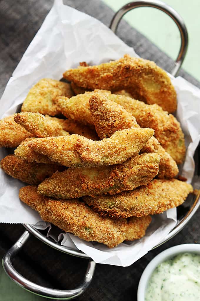 top view of baked avocado fries in a metal bowl.