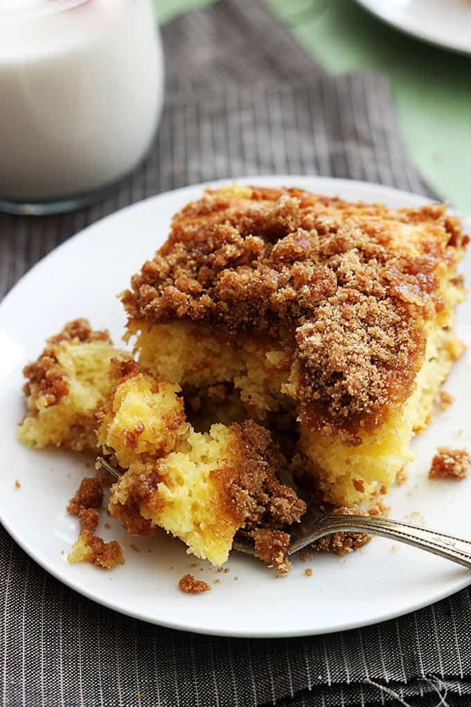 close up of a piece of cake mix sour cream coffee cake with a bite on a fork.