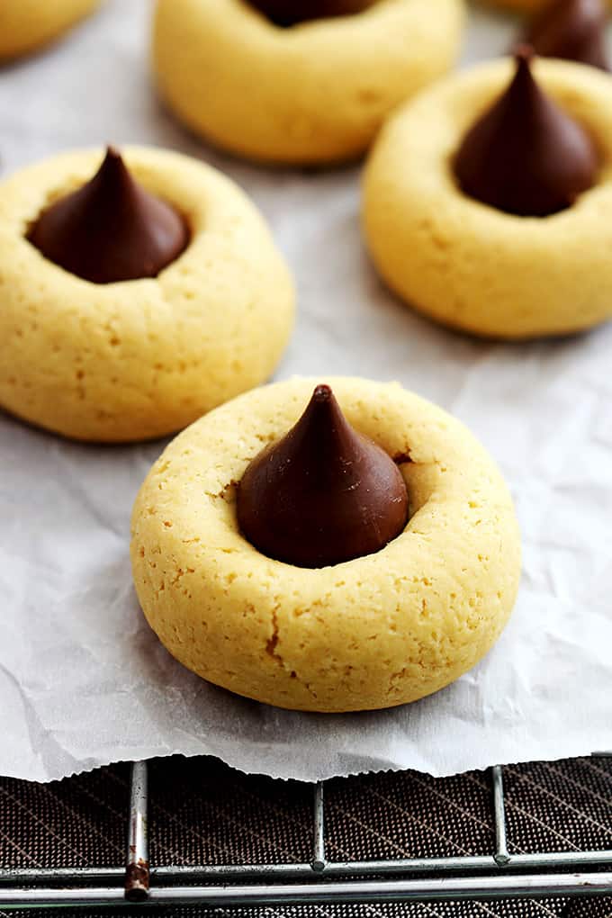 chocolate pumpkin thumbprint cookies on a cooling rack.