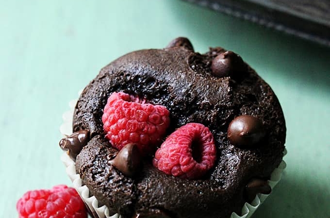 Moist chocolate muffins stuffed with juicy red raspberries!