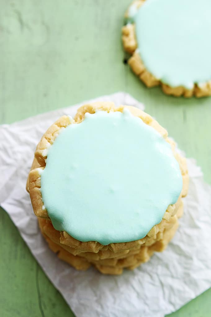 top view of a stack of twigg sugar cookies with a mother cookie on the side.