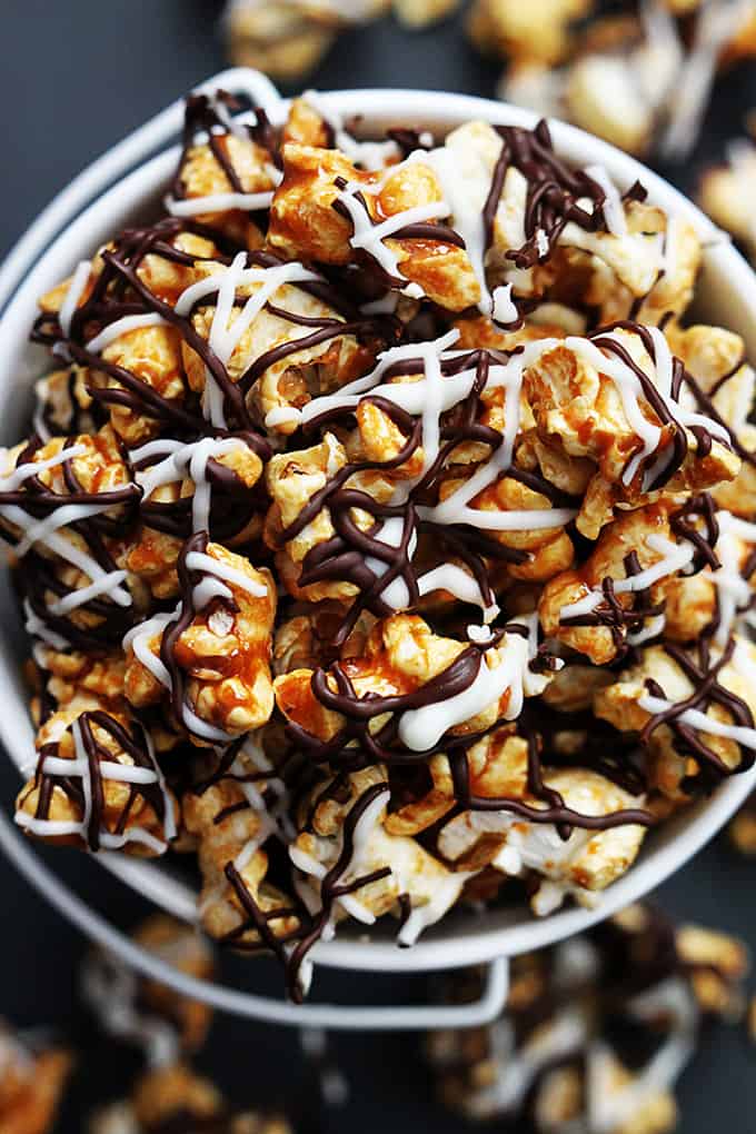 top view of zebra caramel corn in a tin bucket.