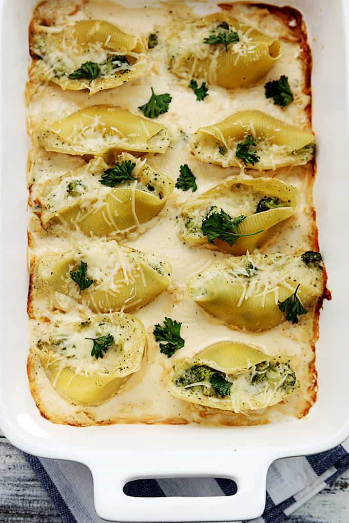 top view of broccoli alfredo stuffed shells in a serving tray.