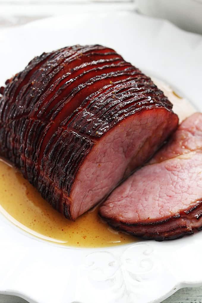slow cooker glazed ham on a plate.