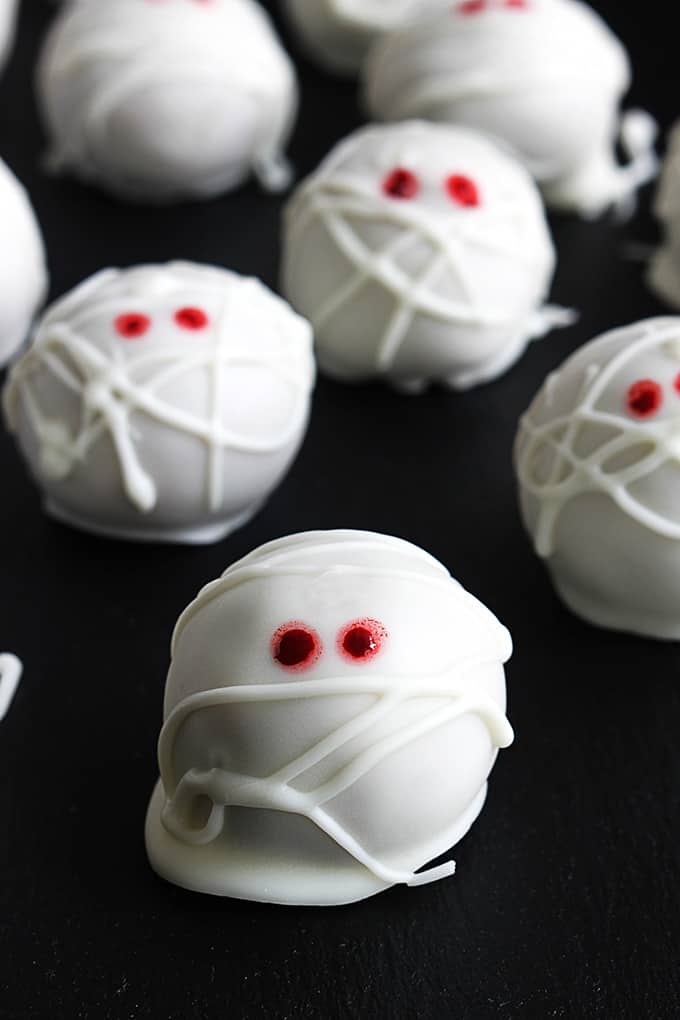 close up of pumpkin cheesecake truffle mummies.