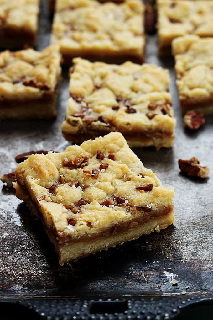 salted caramel pecan butter bars on a baking sheet.