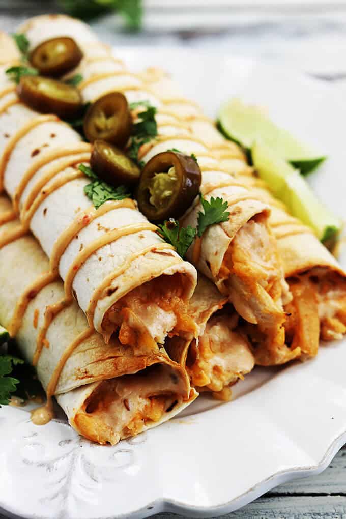 slow cooker chipotle chicken taquitos on a plate.