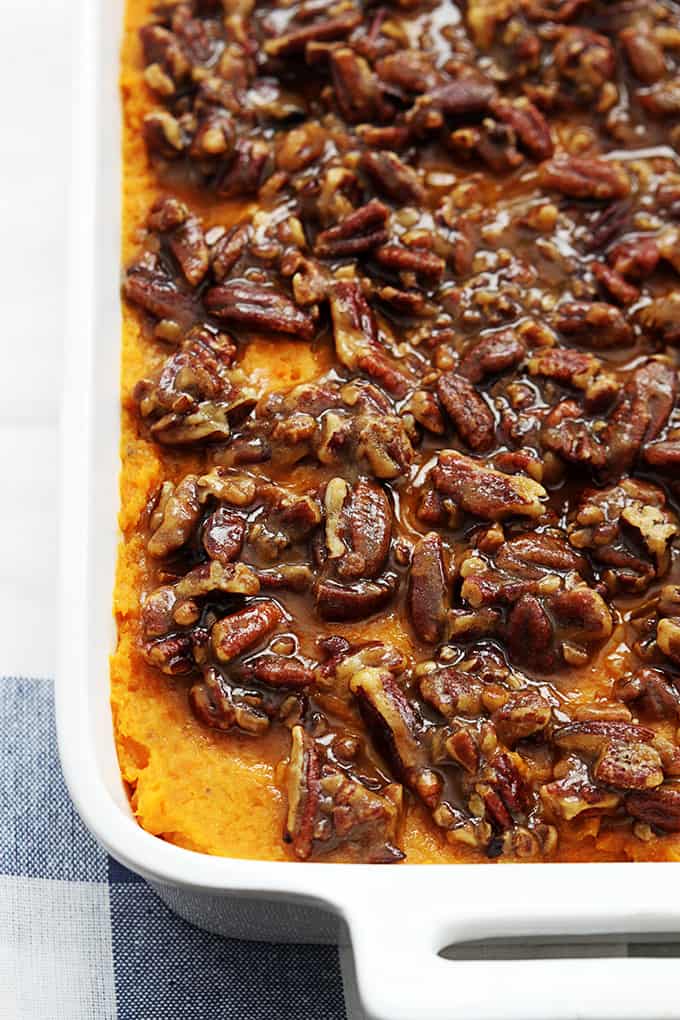 close up of candied pecan sweet potato casserole  in a baking pan.