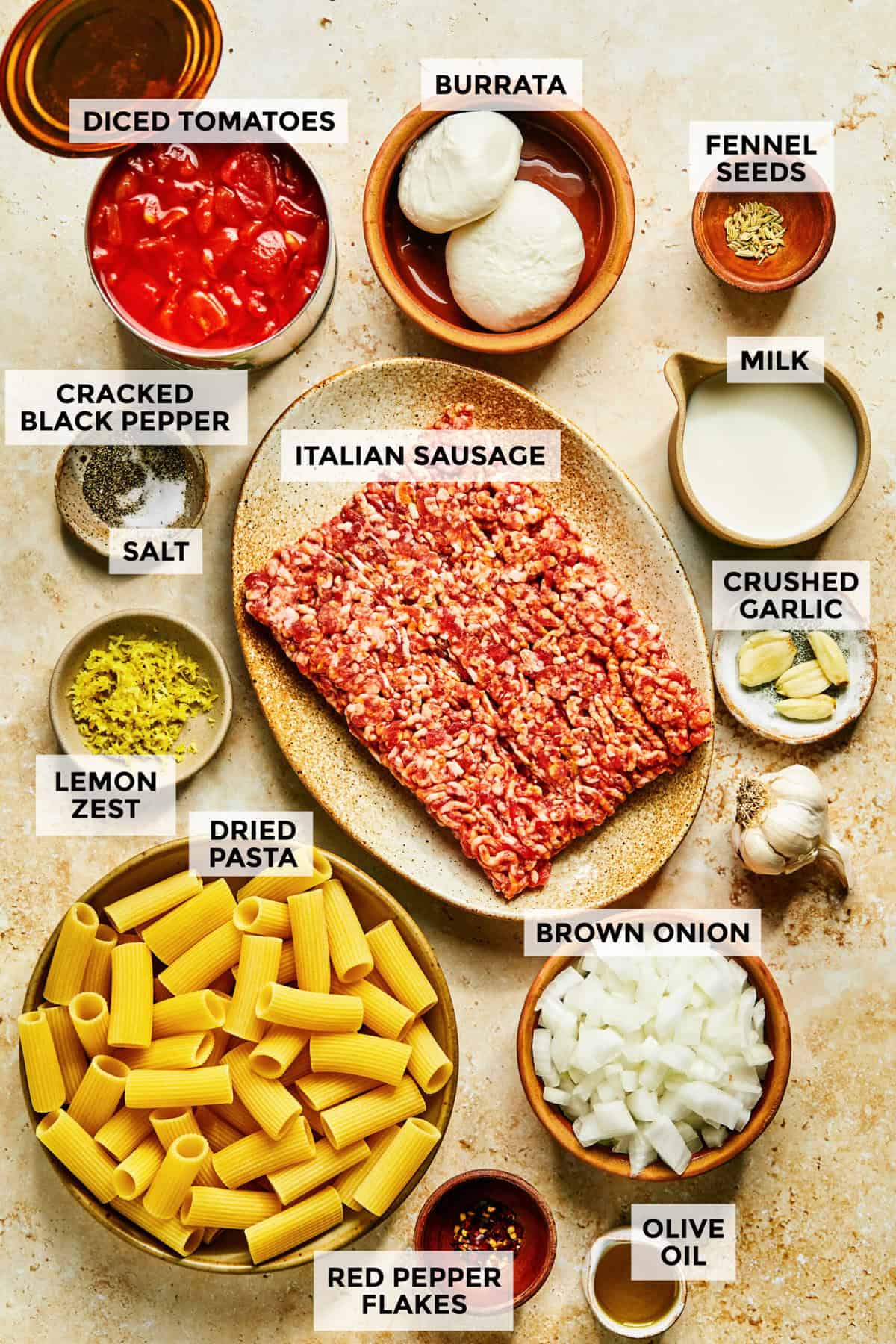 Ingredients for creamy burrata pasta with sausage.