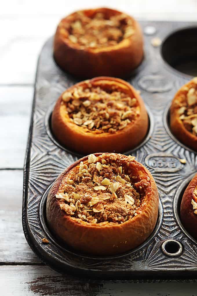 peach crisp stuffed baked peaches in a muffin tin.