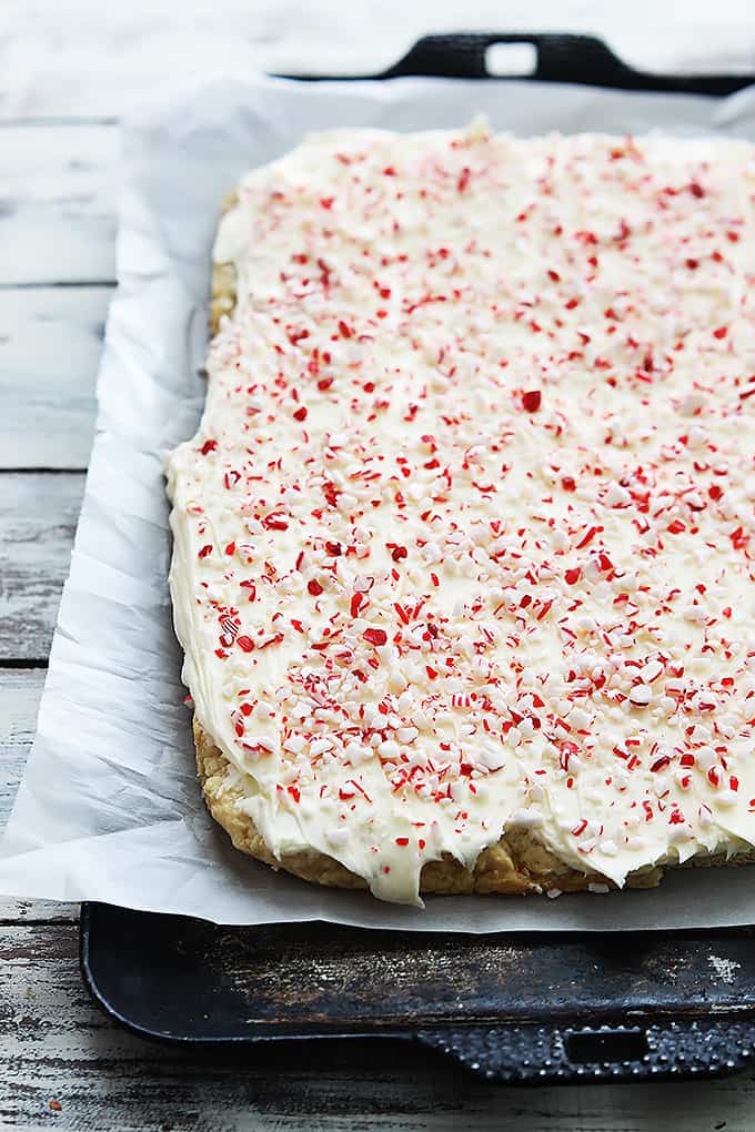 a baking sheet of peppermint crunch sugar cookie bars.