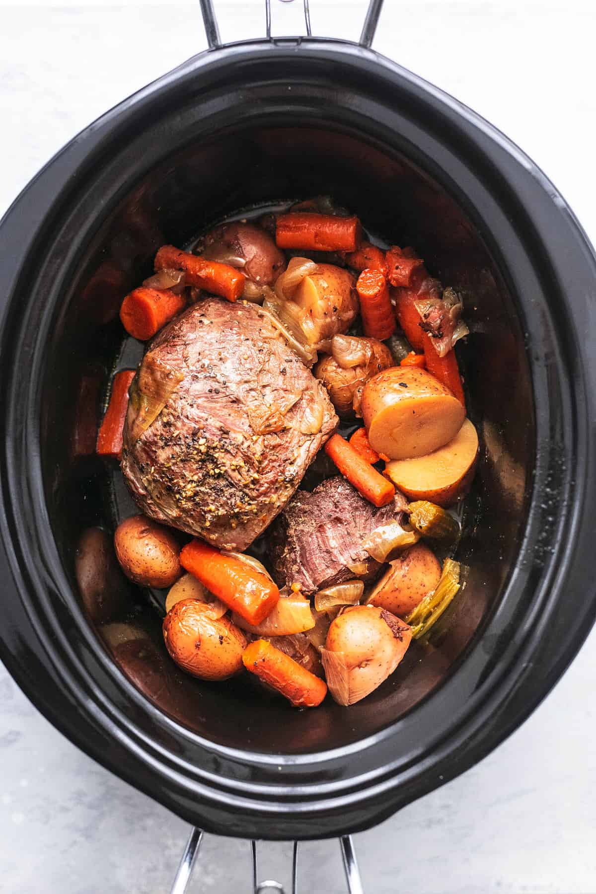top view of slow cooker beef roast in a slow cooker.