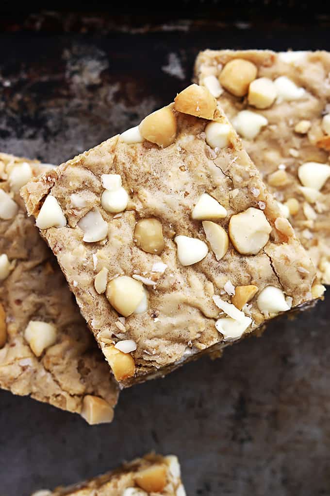 top view of stacked white chocolate chip macadamia nut blondies.