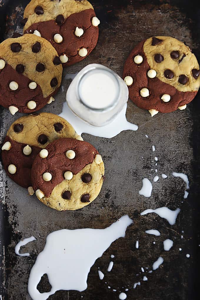 top view of true love cookies (aka: brookies) and a glass jar of milk with milk spilled on the side.