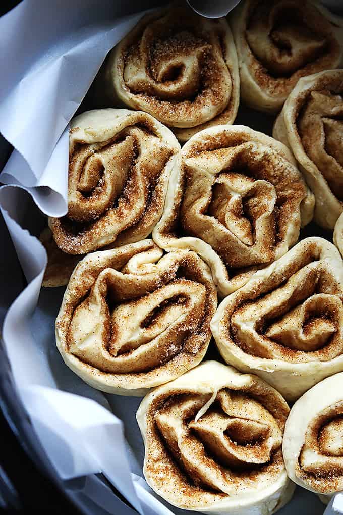 close up of uncooked slow cooker cinnamon rolls in a slow cooker.