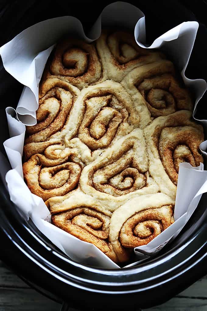 top view of slow cooker cinnamon rolls in a slow cooker.