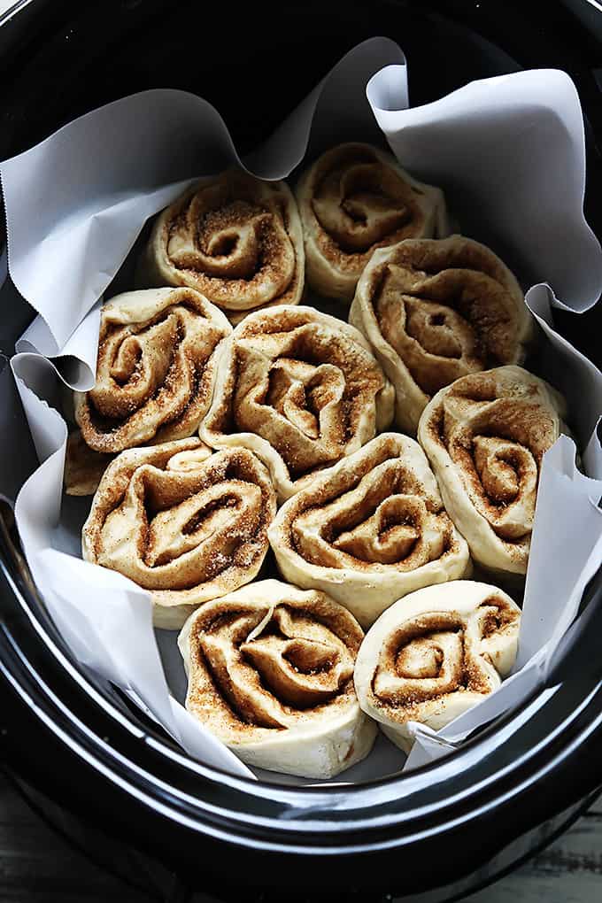 uncooked slow cooker cinnamon rolls in a slow cooker.