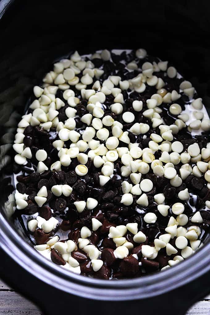 top view of slow cooker fudge ingredients in a slow cooker.