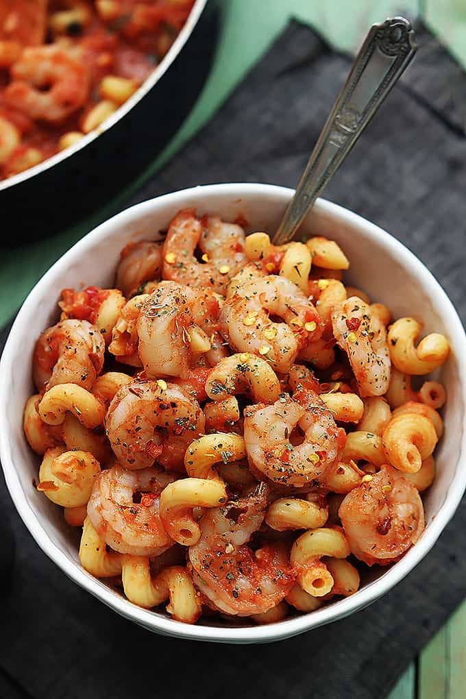 top view of spicy tomato garlic shrimp pasta in a bowl.