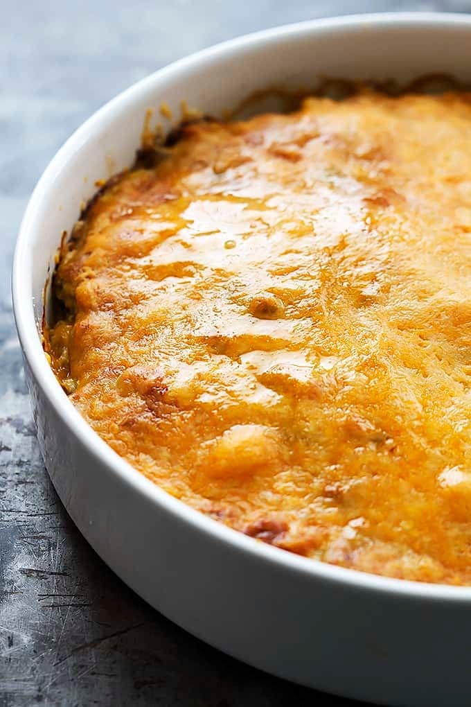 chicken verde tortilla pie  in a round serving pan.