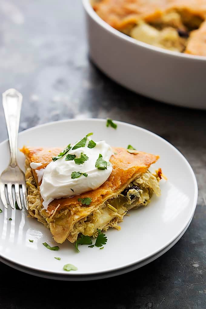 chicken verde tortilla pie with a fork on a plate.