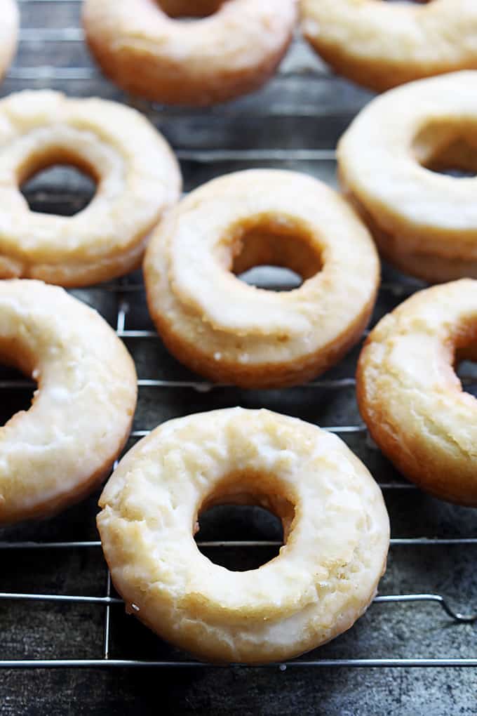old fashioned sour cream donuts on a cooling rack.