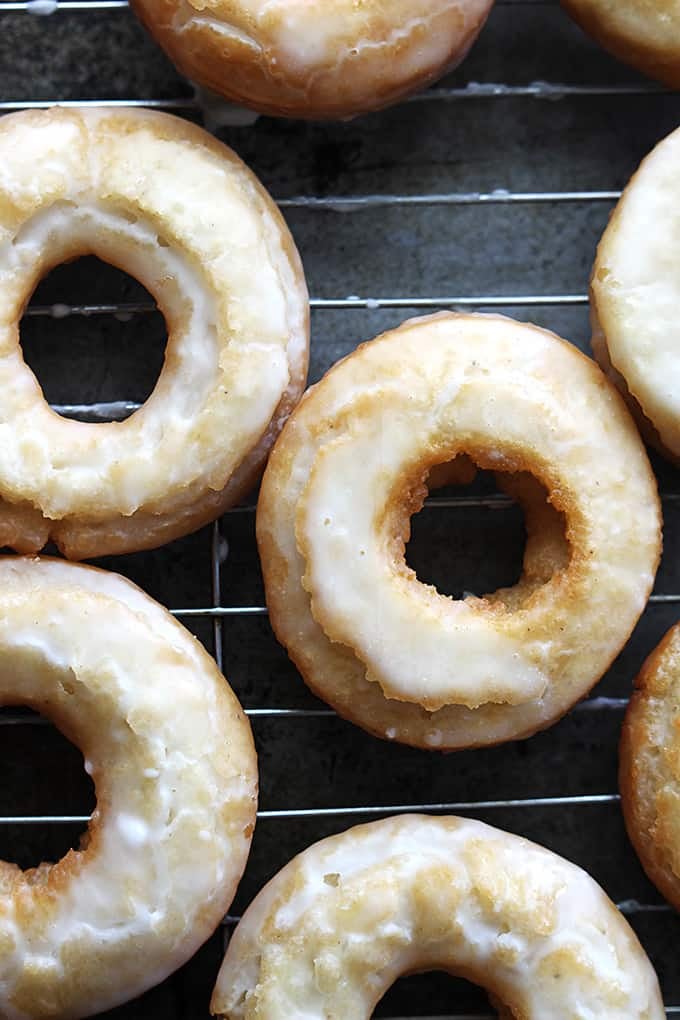 top view of old fashioned sour cream donuts on a cooling rack.