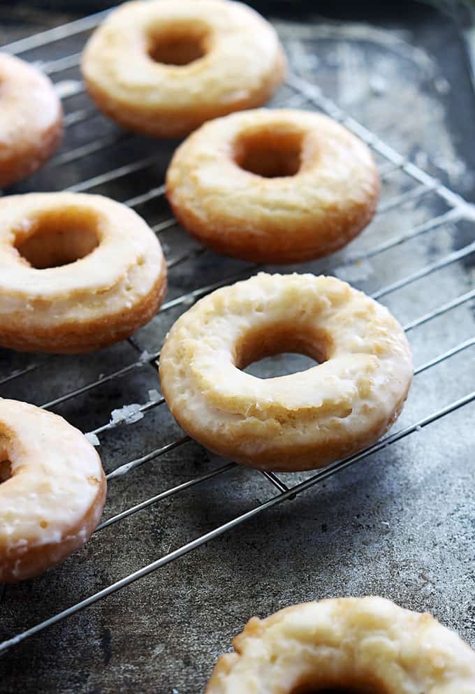 old fashioned sour cream donuts on a cooling rack.