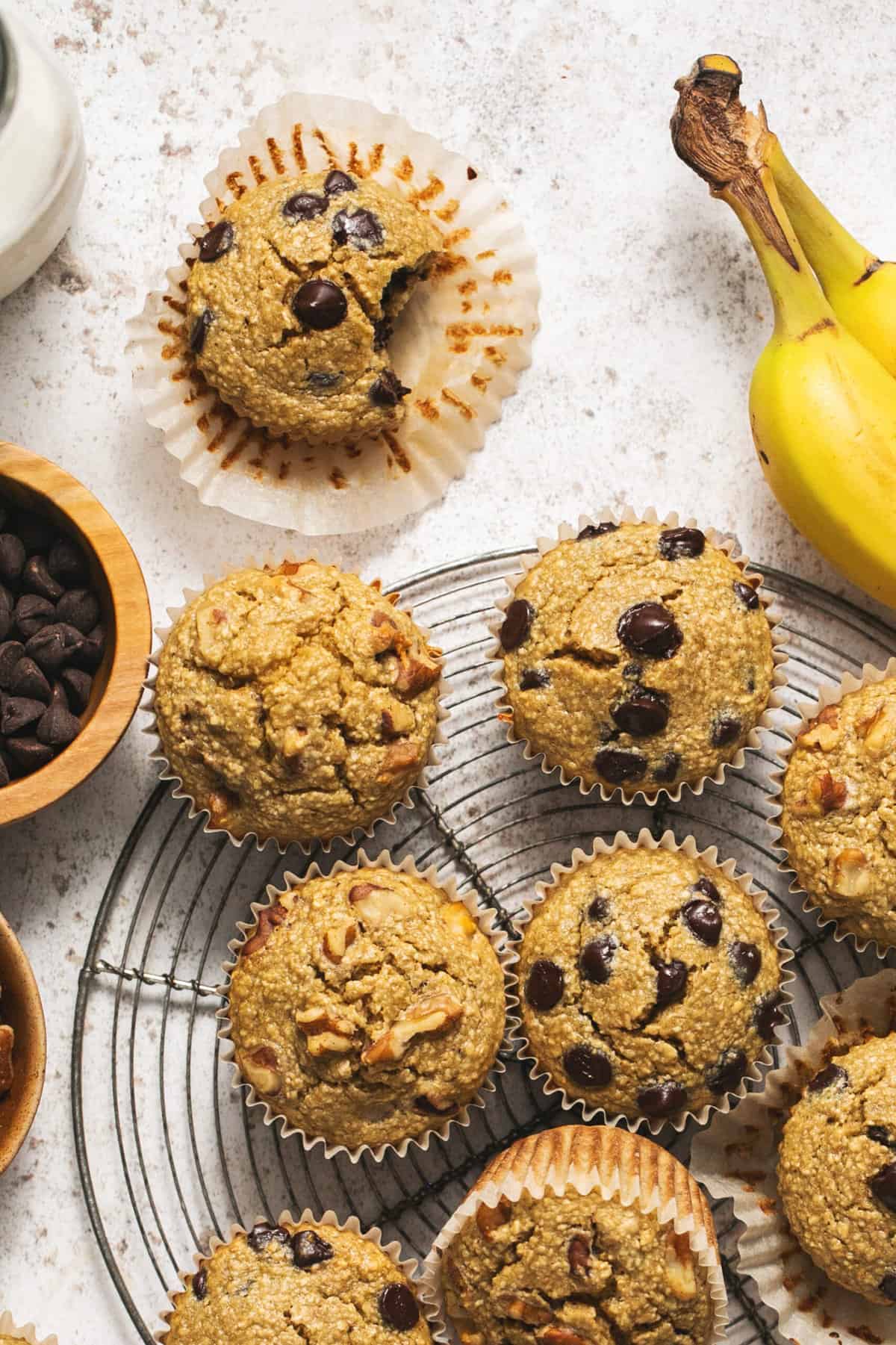 overhead view of banana muffins with different toppings on table