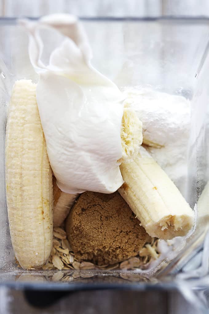 flourless banana blender muffin ingredients unmixed in a blender.