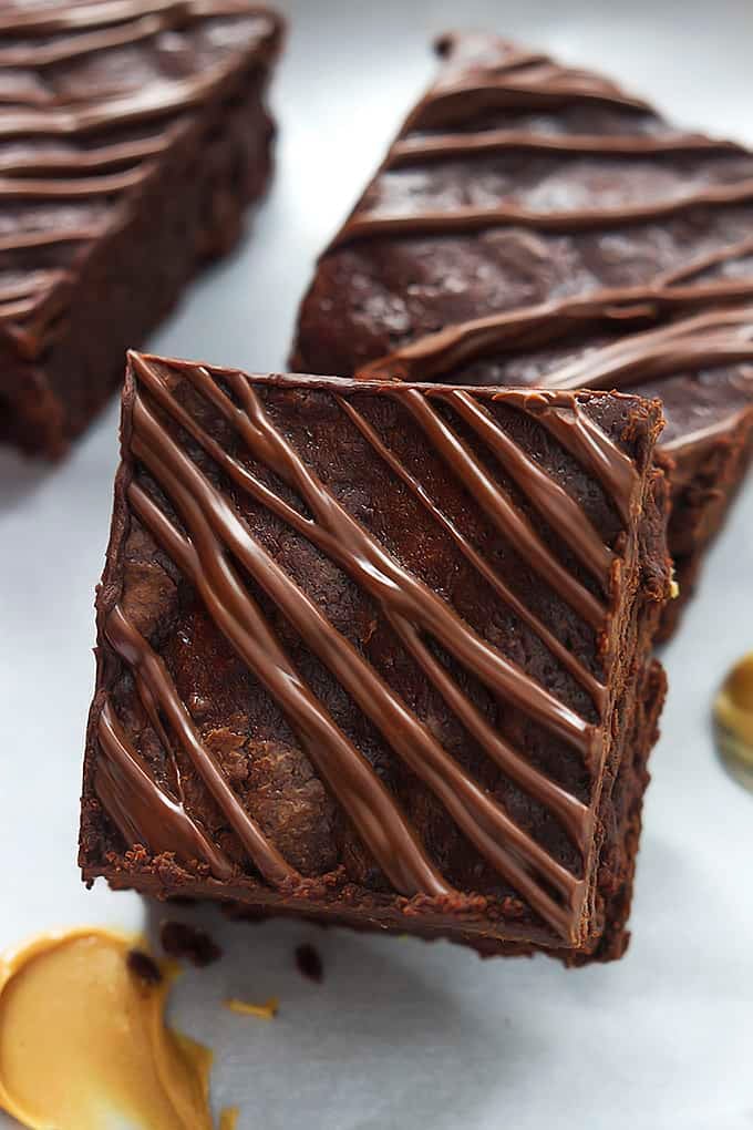close up of stacked flourless fudgey peanut butter brownies.