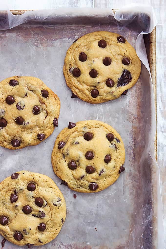 top view of hot fudge stuffed chocolate chip cookies on a baking sheet.