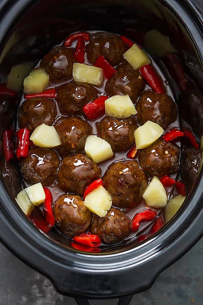 top view of slow cooker sweet & sour meatballs in a slow cooker.