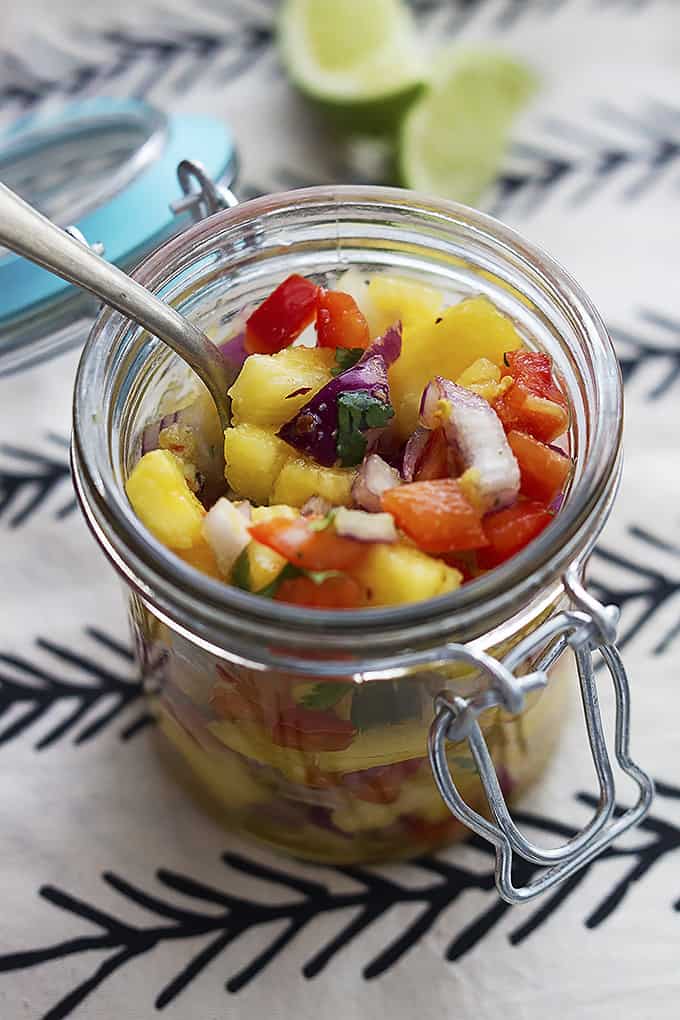 salsa and a spoon in a jar.