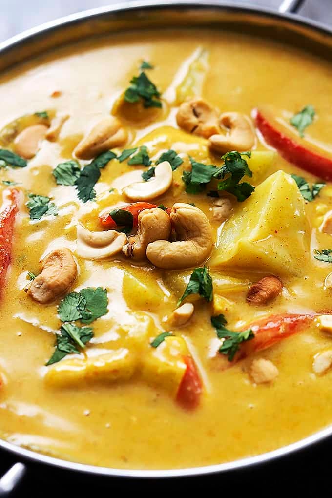 close up of slow cooker coconut curry cashew chicken in a cooking pan.