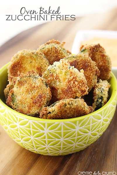 baked zucchini fries in a bowl with the title of the recipe written on the top left corner of the image.