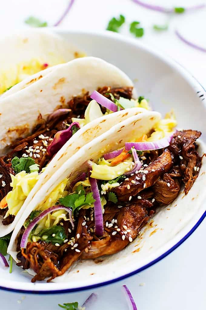 slow cooker Korean bbq pork tacos on a plate.