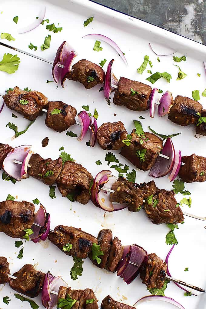 grilled steakhouse kabobs on a baking sheet.