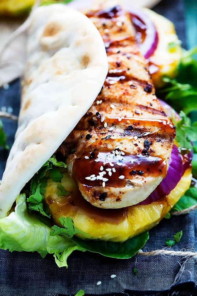 close up of a grilled pineapple teriyaki chicken wrap.