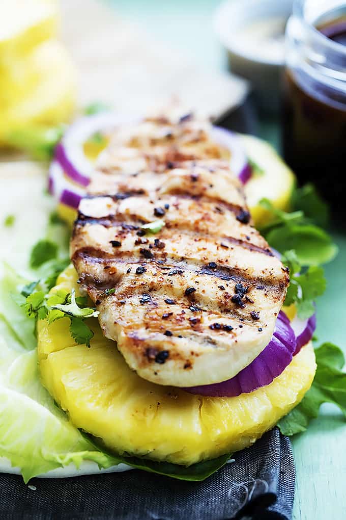 close up of an open grilled pineapple teriyaki chicken wrap.