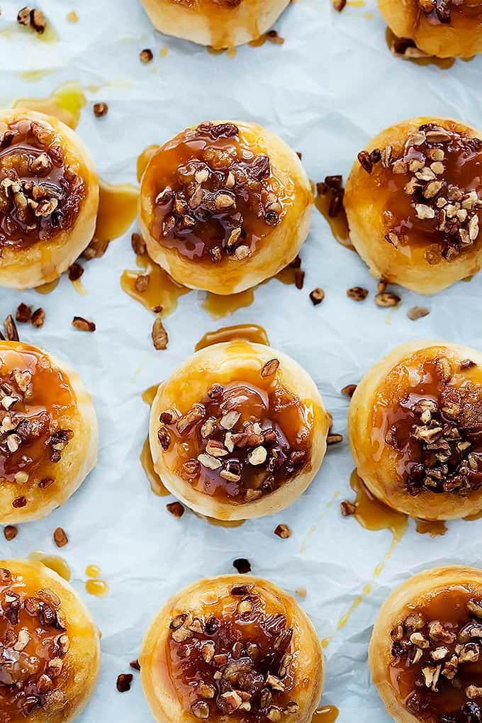 top view of mini caramel sticky buns topped with caramel and nuts.