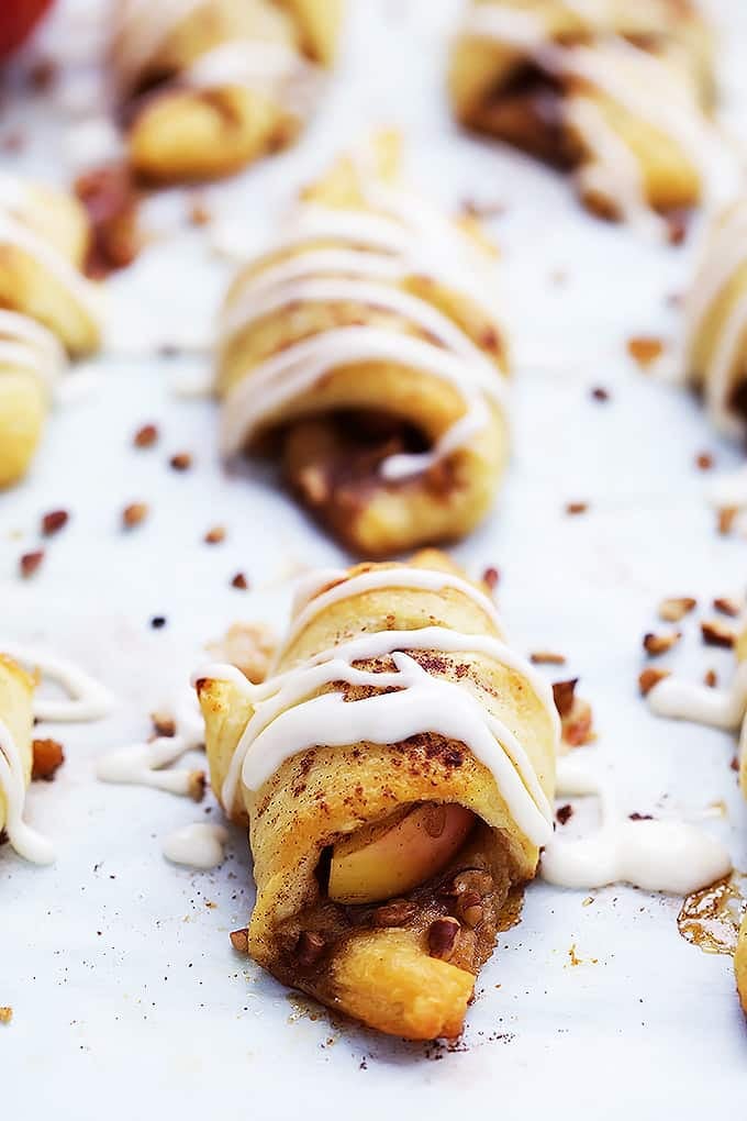 a apple pie roll up with more faded in the background.