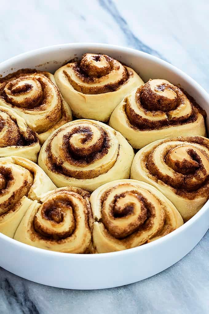 mashed potato cinnamon rolls in a round dish.