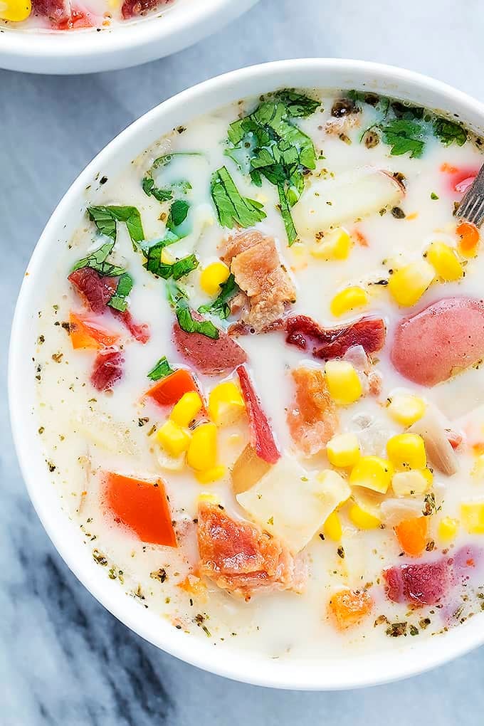 close up top view of a bowl of slow cooker potato bacon corn chowder.