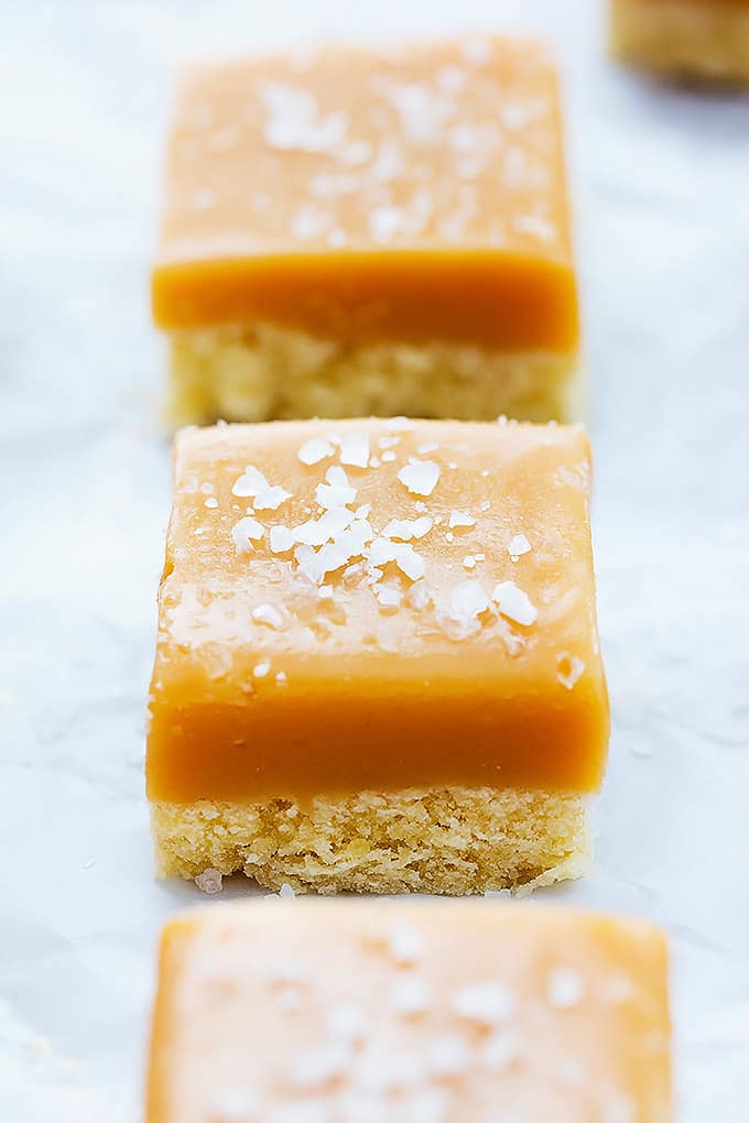 close up of salted caramel shortbread cut into bite sized pieces.