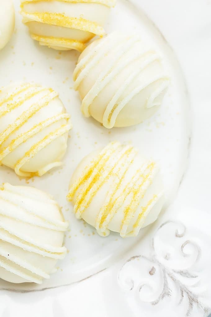 close up top view of eggnog truffles on a plate.